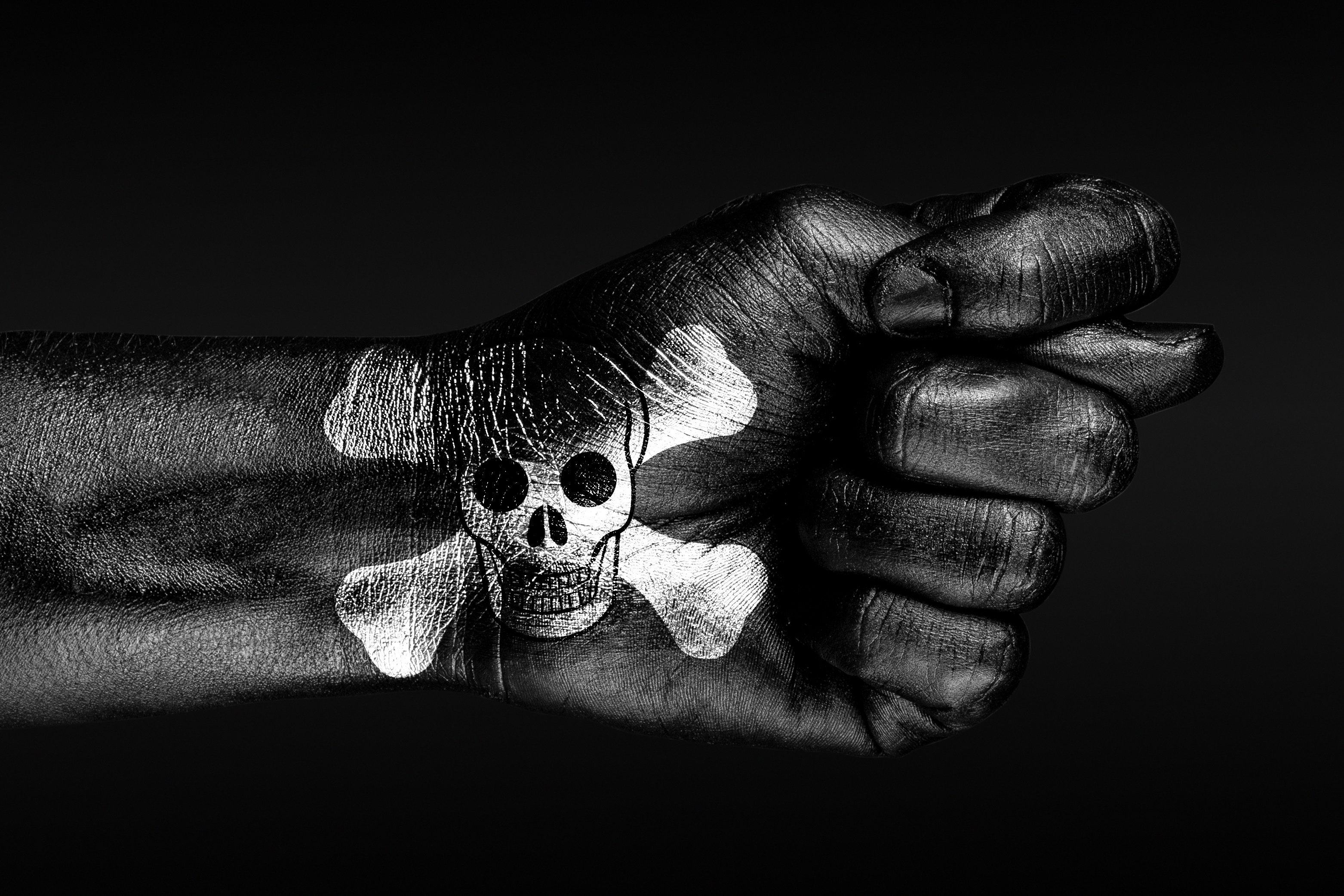 Hand with pirate skull