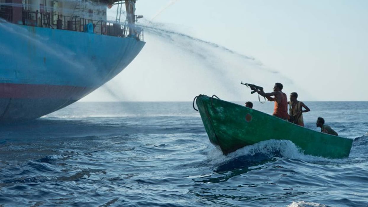 Somalian Pirates with weapons repelled by fire hoses